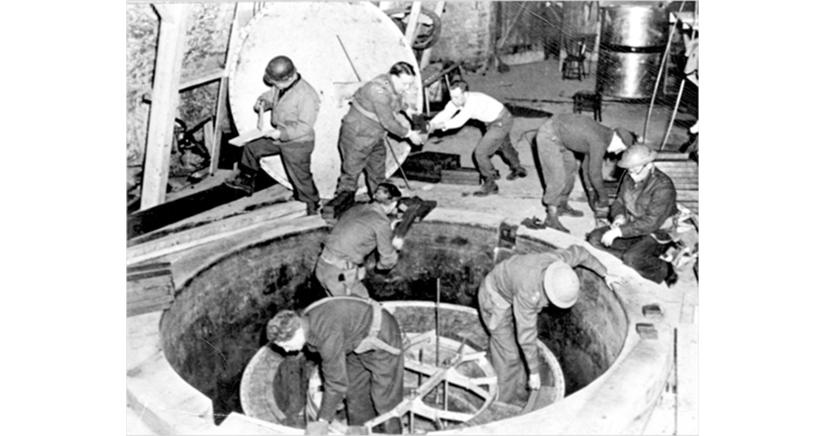 Allied troops climbing in and out of a captured reactor.